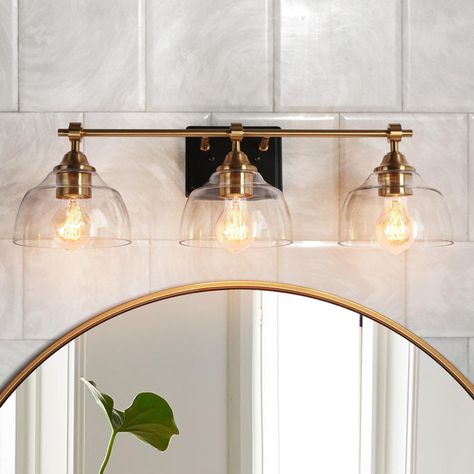 Vanity Light Over Arched Mirror, Brass Bathroom Lighting Over Mirror, Organic Modern Bathroom Vanity Lights, Coastal Bathroom Vanity Lighting, Champagne Bronze Vanity Light, Vanity Light Fixtures Bathroom, Gold Light Fixture Bathroom, Black And Gold Bathroom Fixtures, Bathroom Vanity Lighting Black