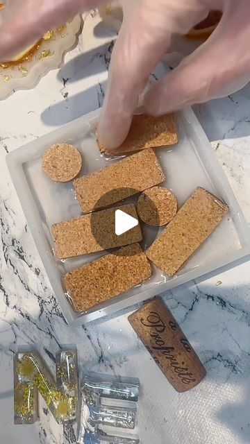 Resin About | Katherine Price on Instagram: "Well you guys enjoyed the last reel of this make so here’s a new one…this collection of handmade coasters featuring wine corks and mesmerizing gold leaf on sleek black shimmering resin - Finished piece shown at the end 🖤✨

These coasters are a beautiful fusion of classic and contemporary design. Each coaster is meticulously handcrafted, incorporating real wine corks that bring a touch of rustic charm. The wine corks are showcased within a striking black resin, adorned with luxurious gold leat accents, creating a stunning contrast that catches the eye.

Set the stage for your next wine tasting or gather around with friends for a refreshing cocktail - these coasters are the perfect conversation starter. 

🌟Elevate your sips in style with these w Wine Cork Diy Projects, Wine Cork Coasters, Resin Art Canvas, Cork Diy Projects, Wine Cork Diy, Potted Plants Outdoor, Cork Diy, Cork Art, Diy Resin Projects