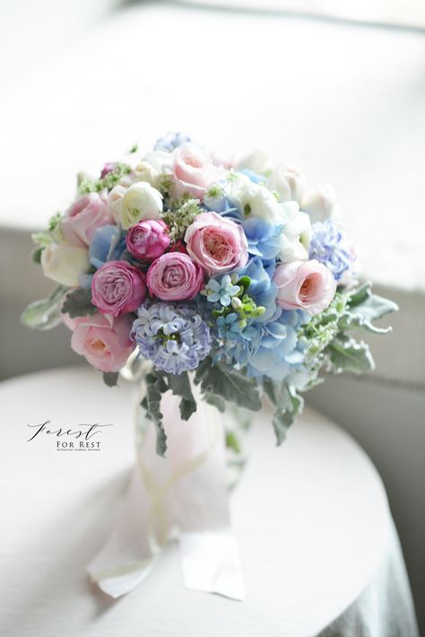 Blue hydrangea, garden rose and ranunculus bouquet  blue and pink bouquet  Facebook: Forest for Rest Ranunculus Hydrangea Bouquet, Blue Hydrangea Garden, Blue And Pink Bouquet, Blue Hydrangea Centerpieces, Delphinium Bouquet, Blue Hydrangea Bouquet, Realistic Wedding, Ranunculus Bouquet, Pink Roses Wedding