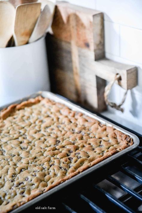 Rich and chewy sheet pan chocolate chip cookie bars have thick, crusty edges and a soft, chocolatey center. Easy to make and faster than traditional cookies! Chocolate Chip Pan Chewy, Chocolate Chip Cookie Bars 10x15, Choco Chip Cookie Bars, Cookie Sheet Recipes, Cookie Sheet Cookies, Chocolate Chip Cookies Bars 9x13, Easy Jelly Roll Pan Bars, Weekend Baking Ideas, Chocolate Chip Cookie Sheet Pan