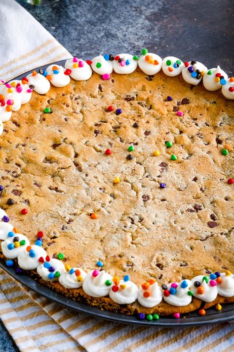 An easy and delicious recipe for Giant M&M Cookie Cake is best served warm with a scoop of ice cream.  Crisp edges and a chewy, gooey center are what make this extra-large cookie recipe the best! It's perfect to share with friends and family on any occasion. M&m Cookie Cake Recipe, Giant Cookie Recipe, Giant Cookie Cake, Ultimate Chocolate Chip Cookie, Scoop Of Ice Cream, Pan Cookies, M M Cookies, Cookie Pizza, Giant Cookie