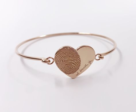 "ACTUAL FINGERPRINT AND HANDWRITING BRACELETS This bracelet is personalized with the actual fingerprint and handwriting you provide us.It is good for Anniversary, Birthday or Wedding gift. ----- ITEM   DETAILS ----- 1.M A T E R I A L S GOLD-FILLED (hypoallergenic)     -14K Gold fill is a pressure-bonded layer of gold that has 100 times more gold than plated jewelry. It is durable, won't chip or flake, is tarnish-resistant, and is a great alternative to \"karat\" gold that is reasonably priced. L Handwriting Bracelets, Bracelets Heart, Heart Bracelets, Handwriting Bracelet, Engraved Handwriting, Fingerprint Jewelry, Gold Bracelets, Vermeil Jewelry, Charm Bangle