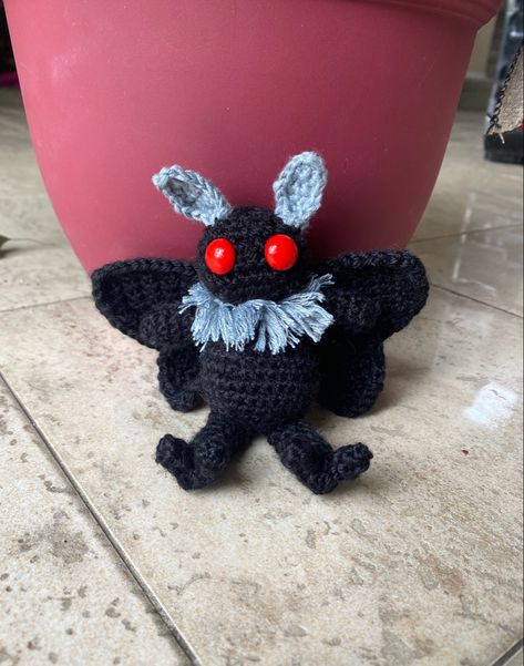 A small crocheted mothman with red eyes, wings, claws and a fluffy neck Mothman Amigurumi, Crochet Mothman, Mothman Crochet, Crochet Plushie, Crochet Kids, The Terror, Point Pleasant, Fun Crochet Projects, Halloween Crochet