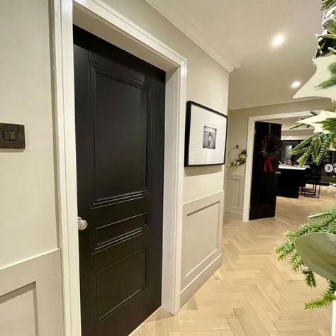 Black panelled internal door Black Doors And Skirting Boards, Internal Black Doors, Black Doors Hallway, Hallway Black Doors, Hallway With Black Doors, Black Hallway Doors, Black Internal Doors, Stair Panelling, White Hallway Ideas