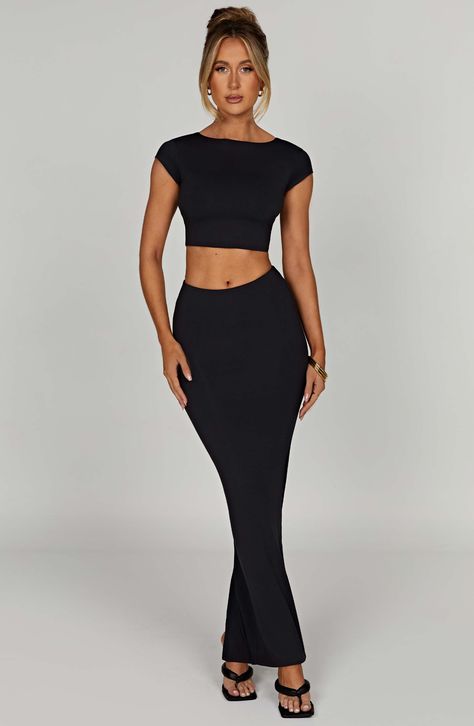 Double lined with a buttery soft, second skin feel, our brand new Yasmin maxi skirt is one to wear on repeat. Serving stretch and snapping back to shape to contour your body, this mid rise design couldn't be more flattering, falling just below your waist. Pair with the Anika crop top for the basic look of your dreams. Cheap Black Fitted Sets, Cheap Fitted Black Sets, Cheap Black Flared Maxi Skirt, Luxury Black Maxi Length Sets, Crop Top High Waisted Skirt Night Out, Luxury Black Stretch Maxi Skirt, Affordable Black Stretch Maxi Skirt, Cheap Black Maxi Skirt For Day Out, Black Slick Skirt