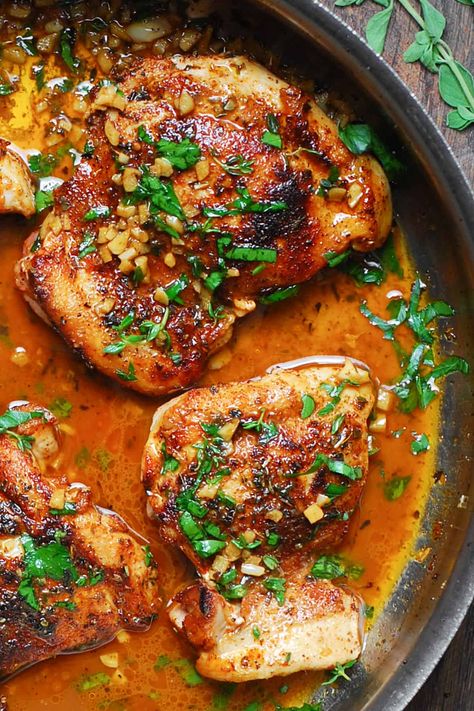 cajun chicken with garlic lemon butter sauce in a stainless steel pan. Cajun Chicken Bake, Cajun Butter Chicken Thighs, Baked Lemon Butter Chicken, Cajun Chicken Thigh Recipes, Stainless Steel Pan Recipes, Cajun Chicken Marinade, Cajun Honey Chicken, Cajun Chicken Bites, Best Dumpling Sauce