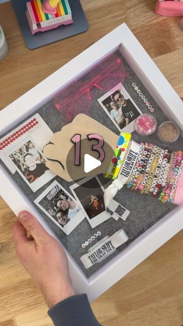 Mark Polchleb on Instagram: "Build my Eras Tour memory shadow box with me ✨   I didn’t put every single item into this, but kept it to key things that sum up my experience: from the creativity of making my oufits, to the special moments at each of my shows.   I also wanted to come up with a way to showcase the friendship bracelets so they could be seen and read.  #tstheerastour #sydneytstheerastour #melbournetstheerastour #erastourshadowbox #taylorswift #friendshipbracelets" Diy Shadow Box Ideas Memories, Eras Tour Memory Frame, Eras Tour Shadow Box Ideas, Eras Tour Memory, Memory Shadow Box, Memory Book Diy, Shadow Box Ideas, Photos Of Taylor Swift, Diy Shadow Box