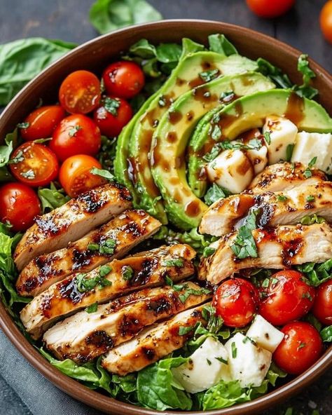 ￼  🍗🥗Grilled Chicken Salad with Balsamic Dressing🍗🥗  Ingredients: Marinade: ¼ cup balsamic vinegar 2 tablespoons olive oil 2 teaspoons brown sugar 1 teaspoon minced garlic 1 teaspoon dried basil 1 teaspoon salt Salad: 4 skinless chicken thigh fillets 5 cups Romaine or cos lettuce leaves, washed and dried 1 avocado, sliced 1 cup cherry or grape tomatoes, sliced ½ cup bocconcini cheese ¼ cup basil leaves, thinly sliced 1 pinch salt, to season 1 pinch pepper, to season Directions: In a small bowl, whisk together the balsamic vinegar, olive oil, brown sugar, minced garlic, dried basil, and salt to make the marinade. Place the chicken thigh fillets in a shallow dish. Pour 4 tablespoons of the marinade over the chicken and toss to coat evenly. Reserve the remaining marinade for use as a dres Salads With Chicken, Mince Dishes, Balsamic Salad, Healthy Food Menu, Dried Basil, Healthy Food Inspiration, Balsamic Chicken, Balsamic Dressing, Healthy Food Dishes