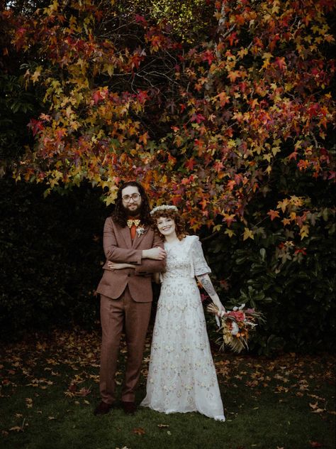 Late october autumn wedding in Surrey, UK. Bride’s dress by Needle and Thread. Groom’s suit by Gianni Feraud. Photo by devlinphotos Flowers by thedriedflowercollection21 Makeup by makeup_by_millierose Curls crafted by spookyruno #autumnwedding #fallwedding #rocknrollbridemagazine #rockmywedding #alternativebride #curlyhair #curlyshag #bohowedding #weddingonabudget Autumn Boho Wedding, Rock N Roll Bride Magazine, Late Fall Wedding, Autumn Wedding Decor, Needle And Thread Dresses, Late Summer Wedding, October Flowers, Late Summer Weddings, October Autumn