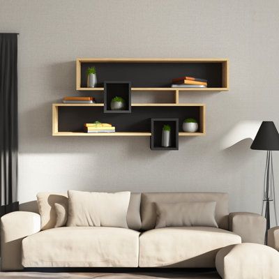 This Wall Shelf's sleek and modern style makes it the ideal accent piece for any space. This shelf is the perfect answer whether you want to show off your favorite books, decorative objects, or just keep your necessities close at hand. It is a real statement piece because of its striking contrast of white and walnut, which elevates any design. With the simple installation method that comes with it, you can quickly and easily attach our Wall Shelf to the wall. Its dimensions allow it to suit well Simple Bookshelf Design, Shelf Book Wall, Bookshelf Design Wall, Open Shelves Bedroom, Book Shelf Wall Ideas, Wall Shelves For Books, Book Shelves Diy, Unique Shelving Ideas, Wall Corner Shelves