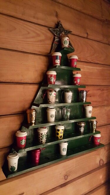 Christmas tree Starbucks ornament cup holder.  It can hold up to 43 ornament cups. #Starbucks #Christmas Starbucks Tree Christmas, Starbucks Christmas Ornaments, Starbucks Themed Christmas Tree, Starbucks Ornaments Display, Starbucks Christmas Decorations, Mug Tree Ideas, Starbucks Decorations, Starbucks Christmas Tree, Starbucks Ornaments