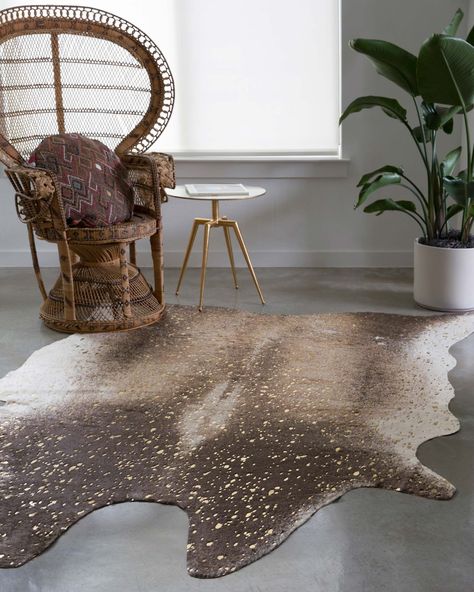 A compelling variant of the timeless cowhide rug, the Bryce Collection touts rich metallic accents set against versatile neutral tones. Power-loomed in China of 100% acrylic, Bryce offers long-wearing durability for your busiest living room, dining area, or entry way. Pile Height: 0.13" Backing: No Backing Weight: 0.0700 lbs/sq ft Color: Mocha & Gold Sizes: 3'-10" x 5' 5' x 6'-6" 6'-2" x 8' Care Instructions Clean spills immediately by blotting with a clean sponge or cloth. Professional cleaning Faux Cowhide Rug, Alexander Home, Kitchen Ikea, Faux Cowhide, Hide Rug, Artisan Rugs, Loloi Rugs, Gold Rug, Cowhide Rug