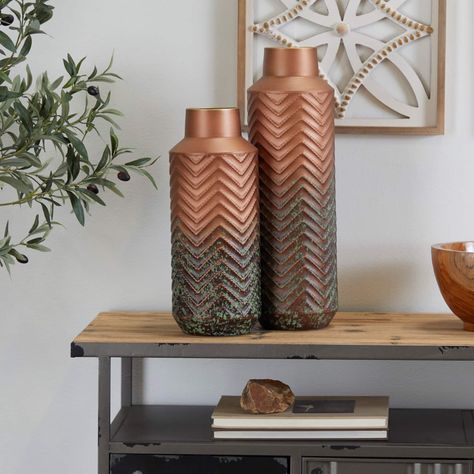 "Get the Copper Metal Embossed Chevron Vase Set of 2 20\", 16\" at Michaels. com. Give your home a personalize touch and bring your creative vision to life. Decorate with ease with our eclectic range of home decor. Decorate with fun with Iris And Ivory A rustic inspired piece is natural in design, and fills the home with a relaxed and warm ambiance. Rustic vases are crafted from highly durable iron. Round modern vases feature a matte metallic copper upper body with dark patina gradient towards t Copper Vases, Colored Vase, Copper Vase, Rustic Vase, Flower Vases Decoration, Colored Vases, Metal Vase, Style Rustique, Modern Vase