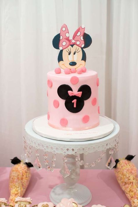 If you want to keep it simple decorate a pale pink cake with darker pink polka dots and place a Minnie Mouse fondant silhouette of the front. Finish the cake off with a fun cut-out of Minnie Mouses head. The finished result is amazing! See more party ideas and share yours at CatchMyParty.com #catchmyparty #partyideas #minniemousecake #minniemouseparty 1st Birthday Cake For Girls Simple, Minnie Cake Ideas, Minnie Mouse Cake Ideas, Mouse Cake Ideas, Minnie Mouse 1st Birthday Cake, Minnie Birthday Cake, Bolo Do Mickey Mouse, Minnie Mouse Birthday Party Decorations, Minnie Mouse Birthday Cakes