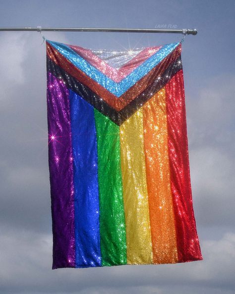 A Rainbow Progress Pride flag made out of sequin fabric sparking in the sunlight in front of a blue sky Pride Progress Flag, Original Pride Flag, Pride Party Aesthetic, Pride Flags Aesthetic, Pride Flag Aesthetic, Queer Flag, Pride History, Pride Photography, Queer Prom