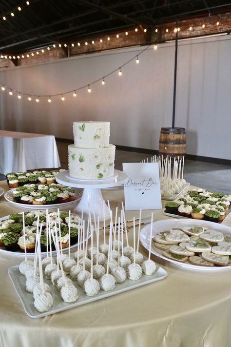 This is our most popular dessert table trend in 2023. Most brides want a 2 tier wedding cake and assortment of cake pops, cupcakes and decorated cookies! Assorted Dessert Table, Ups Cake, Wedding Dessert Display, 2 Tier Wedding Cake, Dessert Display Wedding, 2 Tier Wedding Cakes, Cake Pop Displays, Popular Dessert, Most Popular Desserts