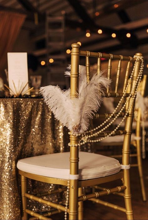 art deco wedding ideas feathers and pearls chair decoration Art Deco Wedding Ideas, Chair Decoration Ideas, Masquerade Party Themes, Old Hollywood Prom, Great Gatsby Prom, Gatsby Birthday Party, Gatsby Gala, Prom Planning, 1920s Wedding Theme