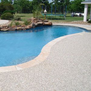 Different Types of Pool Decking | Custom Pool Decking Decks Around Pools, Swimming Pool Images, Deck Renovation, Pool Decking, Cheap Pool, Concrete Deck, Fiberglass Swimming Pools, Gravel Patio, Pool Renovation