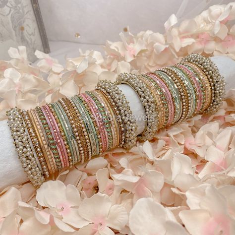 Large stack of antique gold bangles with pretty light Pastel shades of pink, mint and peach finished with sprinkles of crystals and pearls. Ready to Ship Pastel Bridal Jewellery, Pastel Indian Jewellery, Pastel Bangles, Antique Gold Bangles, Desi Jewellery, Fresh Flower Jewelry, Desi Jewelry, Bangle Stack, Haldi Outfits