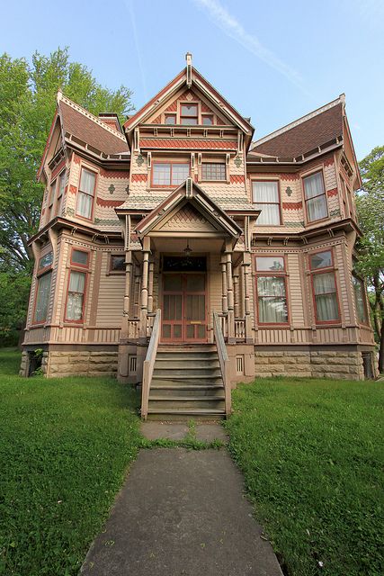 I really like this Stick Style/Eastlake house in Pike County MO. It has an interesting "twist" on the ends, and the details are wonderful. I might balance the orange-y and brown palette with something else, but I do like the paint job. Old Victorian Homes, Pike County, Victorian Style Homes, Chicago Real Estate, Victorian Buildings, Old Mansions, Unusual Homes, Buy A Home, Victorian Architecture