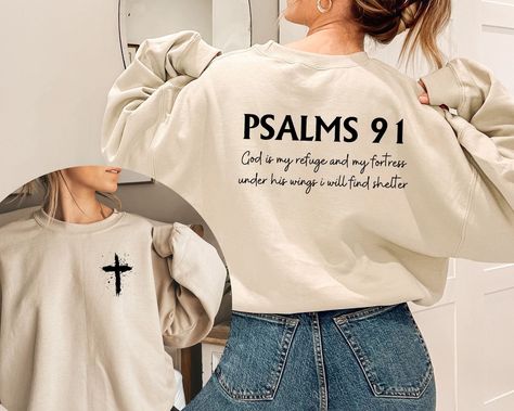 Psalms 91 Sweatshirt, Women Christian Hoodie, Religious Sweater, Bible Verse Hoodie, Faith Based Sweater, Cross Jesus Hoodie, Jesus Love Top Please, Be careful when ordering whether the product is a hoodie or a sweatshirt Gildan Hoodies/Sweatshirts - the perfect blend of comfort, style, and sustainability. Crafted with a careful balance of 50% cotton and 50% polyester, these premium garments offer exceptional softness, durability, and eco-consciousness.  Our Hoodies/Sweatshirts are designed to p Jesus Hoodies, Christian Gift Shop, Psalms 91, Christian Shirts Designs, Christian Merch, Christian Streetwear, Jesus Sweatshirts, Christian Hoodies, Cross Jesus