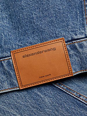 Crafted of cotton denim, this cropped jacket from Alexander Wang is elevated by a contrast faux fur trim and a quilted, satin lining. Faux fur collar Long sleeves, faux fur cuffs Back leather logo patch Button-front closures 100% cotton Filling: 100% polyester Lining: 65% acetate/35% viscose Fur type: Faux Dry clean Imported SIZE  FIT This style is constructed in a woven, no-stretch fabric for a fitted shape About 17 from shoulder to hem Bust, about 35 Model measurements: 5'10 tall Model is wear Alexander Wang Denim, Denim Label, Badge Icon, Fur Cuffs, Embellished Denim Jacket, Fox Fur Jacket, Fur Jackets, Leather Clothing, Guys Clothing Styles