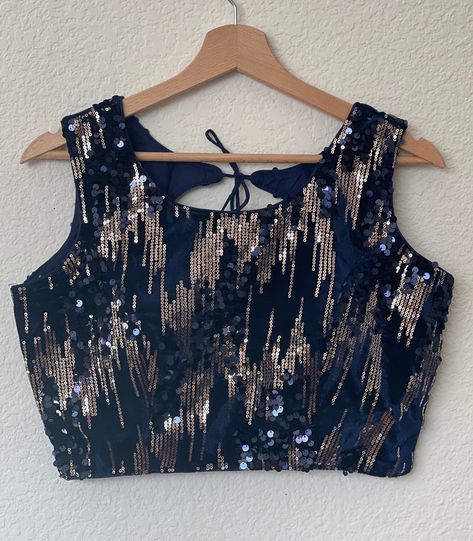 "Blouse details: Fabric : Sequin Velvet fabric Color: Sleeve : Sleeveless ,( comes with a 4\" sleeves separately) Neck : Front 6.5\" / Back : Pot neck with ties / Back open Blouse length : 14.5\" Blouse size : 36\" Margin to alter: 2 inches Padded and ready to wear. Please note: Readymade saree blouses from 4Stripecollections. Revamp your old Sarees's look or your brand new ones with our ready to wear princess cut blouses. We tried to picture the exact color of the blouses, but there's a possibi Off Shoulder Saree Blouse, Fancy Saree Blouse, Back Open Blouse, Pot Neck, Sequin Saree Blouse, Sparkle Blouse, Open Blouse, Sequin Saree, Fancy Saree