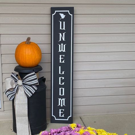 Haunting 'Unwelcome' Sign | Gothic Front Porch Decor Capture the essence of eeriness with our Gothic Unwelcome Porch Sign featuring a haunting raven perched on the letters. Perfect for adding a touch of mystery to your home decor. Get yours today and invite a touch of the dark side to your doorstep. *Available in multiple sizes and colors *Our signs are painted and slightly distressed *Signs vary depending on the grain of the wood and distressing *Real wood has unique imperfections such as bends, knots, and twists *No two signs are the same which gives them a unique quality buyers like *The backs of the signs are not stained or painted *Each sign is made to order so please allow a few days for creating *Intended for indoor use only *All personalized custom sign sales are FINAL *Handmade in Gothic Front Porch, Wooden Porch Decor, Raven Perched, Halloween Porch Decor, Distressed Signs, Wooden Porch, Halloween Porch Decorations, Front Porch Decor, Halloween Sign