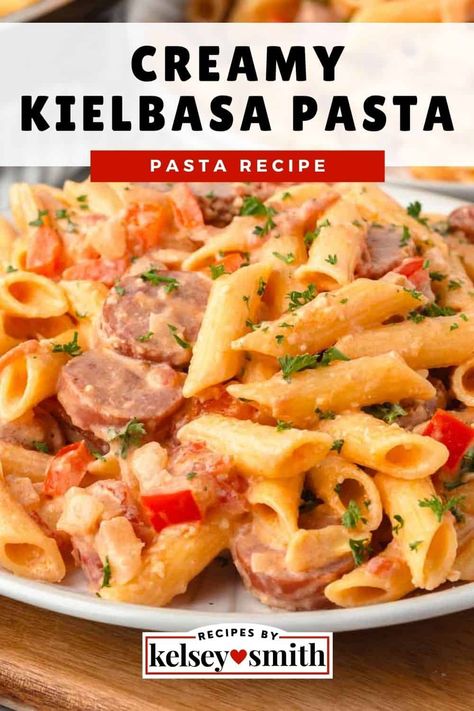 Creamy kielbasa pasta combines sliced smoked sausage, penne pasta, onions, and peppers in a rich sauce of cream and parmesan. This creamy sausage pasta is a total crowd-pleaser the whole family will love because it is creamy, smoky, salty, and savory. It's perfect for those days when you want something hearty without any fuss. Get this easy weeknight dinner on the table in less than 30 minutes. Serve with a side salad and garlic bread. Creamy Kielbasa, Kielbasa Pasta Recipes, Kilbasa Sausage Recipes, Smoked Sausage Recipes Pasta, Sausage Penne Pasta, Kielbasa Pasta, Creamy Sausage Pasta, Sausage Pasta Recipe, Sausage Penne