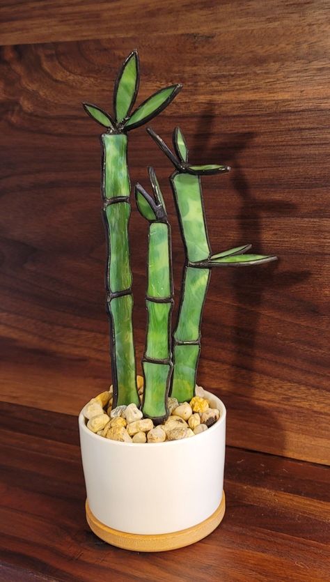 "HANDMADE 3D Stained Glass Bamboo Plant  This is the perfect, maintenance free gift for you or someone you love!  A thoughtful house warming gift or a gift for those always on the go who forget to water their plants. This item is all inclusive; Stained Glass bamboo, ceramic pot, flora foam and top cover pea gravel are included. The bamboo stained glass pieces have a twisted 'rod' like bottom that you will insert into the flora foam. Nothing for you to do but arrange the bamboo then, add the decorative pea gravel.   Assemble measurements are approximately 3.5\" W x 9.5\" H Stained Glass pieces are created one at a time using high quality stained glass, copper foil, copper wire, 60/40 solder and black patina. As each piece is individually handcrafted from start to finish and rarely are any 2 Bamboo Stained Glass Pattern, Stained Glass Bamboo, Stained Glass Plants In Pots, Stained Glass Potted Plant, Quick Stained Glass Projects, Stained Glass Succulent Pattern, 3d Stained Glass Projects, Stained Glass Plants, Modern Stained Glass Art