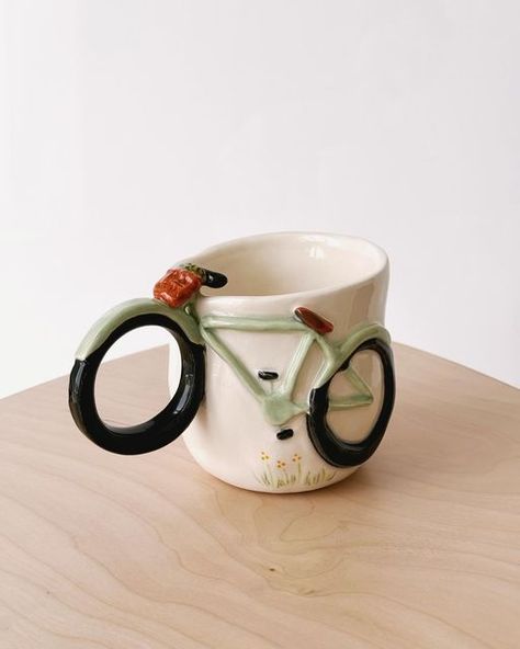 Love in Pottery on Instagram: "beautiful ceramic mug by @huda_marhoon ! 🙈😘💚 FOLLOW👉 @loveinpottery for more pottery contents ☕️ !  visit their page and support 💕  Follow us on @musthomeguide (Interior Lovers) & @mustvisitguide (Travel Lovers) !  #wheelthrown #handmadeceramics #ceramique #ceramicstudio #interiordesign #pottery #artist #ceramicart #ceramicsculpture #handmade #porcelain #contemporaryceramics #ceramica #ceramic #glaze #sculpture #pottersofinstagram #homedecor #ceramics #craft #design #clay #tableware #instapottery #ceramicartist #stoneware" Ceramics Cups Handmade, Sculptural Mug, Ceramics Throwing Ideas, Quirky Pottery Ideas, Ceramic To Go Mug, Ceramic Mug Ideas Handmade, Ceramic Mug Handmade, Handmade Cups Ceramic Pottery, Pottery Mug Shapes