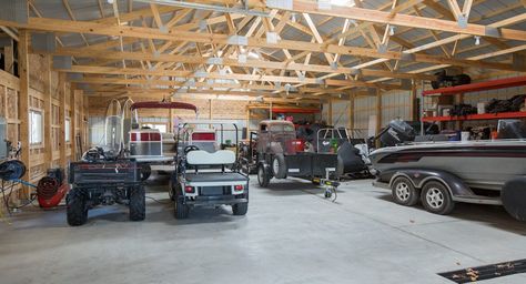 Morton Buildings garage interior in Anoka, Minnesota. Pole Barn Garage Interior, Garage Interior Ideas, Anoka Minnesota, Rv Barn, Metal Pole Barns, Hobby Garage, Garage Build, Pole Barn Garage, Equestrian Building