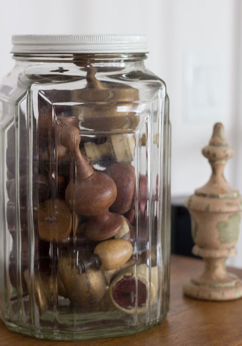 collection-of-finials in jar Family Room Basement, Bright Basement, Sectional Sofa Comfy, Display Collections, Gift From The Sea, Comfy Sectional, Patterned Ottoman, Small Glass Containers, Anne Morrow Lindbergh