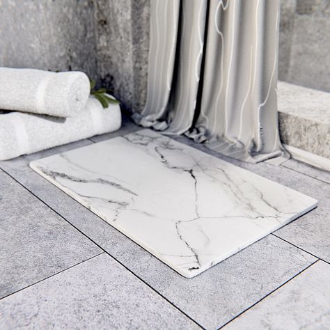 PRICES MAY VARY. The Nuelux Home natural diatomaceous stone mat has high absorbent properties that will quickly evaporate water, never worry about a bacteria stored bath mat again! Our Nuelux bath stone mat is made out of premium quality which allows it to dry quickly. Beautiful modern design that is practical and aesthically your space and decor. The Nuelux Home natural diatomaceous stone mat has high absorbent properties that will quickly evaporate water, never worry about a bacteria stored ba Stone Mat, Stone Bath Mat, Bathtub Mats, Stone Shower, Stone Bath, Bathroom Floor Mat, Diatomaceous Earth, Bathtub Accessories, Shower Mat