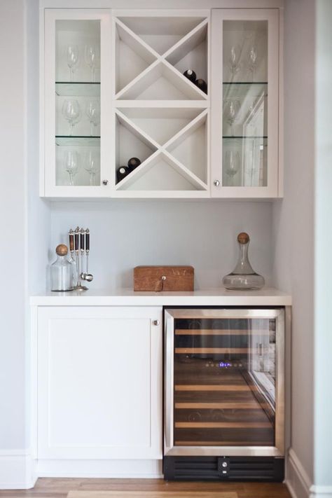 Dining Room decor ideas - a dry bar in your dining room allows you to keep all your bar items organized and is a great option for a small nook. Here, a wine refrigerator and cabinet create the base of the bar. Above, built-in shelving and glass-front cabinets provide wine bottle and glass storage. Refrigerator Ideas, Bar Nook, Built In Bar, Glass Front Cabinets, Home Bar Designs, Dry Bar, Wet Bars, Glass Storage, Wine Cabinets