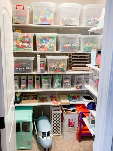 Toy storage closet in a playroom. We used Ikea Boaxel shelving to transform this storage closet. Now that we can better utilize all that vertical space and make this storage closet truly function well for this family. I love the vinyl custom labels that were made and the multipurpose bins from the container store. Small Playroom Organization, Small Kids Playrooms, Toy Cupboard, Playroom Closet, Toy Room Organization, Playroom Inspiration, Small Playroom, Basement Playroom, Kids Toy Organization