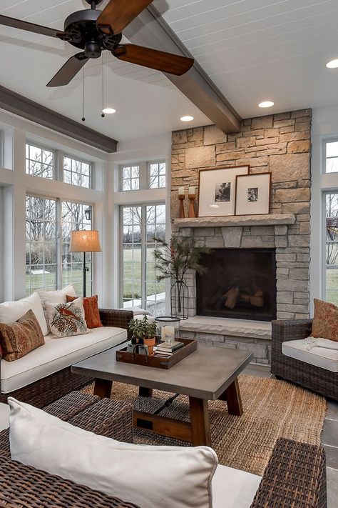 Use Of Stone Fireplace In Beige Tones In The Sunroom Area 4 Season Sunroom Ideas With Fireplace, 3 Season Room With Fireplace, Sunroom Floor Plans Layout, Three Season Porch With Fireplace, 3 Season Porch With Fireplace, 4 Seasons Room With Fireplace, Conservatory Family Room, Four Season Sunroom With Fireplace, Four Seasons Room With Fireplace