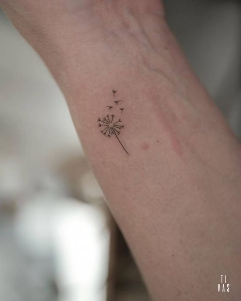 Fine line dandelion tattoo located on the wrist. Dandelion Tattoo Wrist Small, Micro Dandelion Tattoo, Dandelion Stick And Poke, Wrist Dandelion Tattoo, Fine Line Dandelion Flower Tattoo, Tiny Dandelion Tattoo Wrist, Dandelion Tattoo Small Finger, Dandelion Tattoo On Hand, Fine Line Tattoo On Wrist