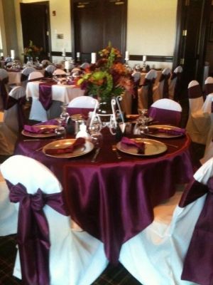 Satin wine overlays and sashes , white chair covers and tablecloths. www.cvlinens.com #wedding #event #tablescape http://ruffledblog.com/recycle-your-wedding/see-ads/2522/120-Silver-charger-plates/Charger-Plates/ Silver Charger Plates, White Chair Covers, Jade Wedding, Purple Bouquets, Ideas For Wedding Decorations, Jewel Tone Wedding, Wedding Gifts For Groomsmen, Rustic Wedding Flowers, Classic Brides