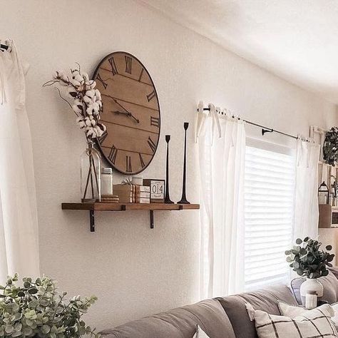 Farmhouse Is My Style on Instagram: "The heart of farmhouse charm 🌾🏡 is perfectly captured in this cozy living space! The neutral tones create a soothing atmosphere, while the mix of textures adds a touch of rustic elegance. The large clock 🕰️ and the delicate greenery 🌿 bring a fresh, inviting vibe. This is the ideal spot to relax and unwind after a long day. (Photo Credit: @amadadecor)

#FarmhouseStyle #CozyLiving #RusticCharm #NeutralDecor #HomeSweetHome" Clock Above Tv, Big Wall Clock Decor Ideas, Clock Wall Decor Layout, Large Wall Clock Decor Ideas, Big Wall Clocks Living Rooms, Wall Clock Decor Living Room Ideas, Large Clock Decor, Wall Clock Decor Ideas, Wall Clock Decor Living Room