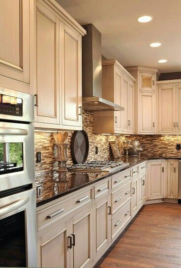 Gorgeous cream cabinets and chocolate counters with a perfactly complementing back splash. Dark Counters, Dark Countertops, Kabinet Dapur, Stunning Kitchens, Pool Design, Kitchen Redo, White Kitchen Cabinets, Kitchen Remodel Idea, Kitchen Makeover