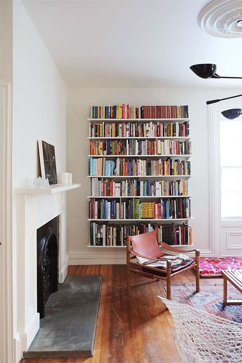 8 Spaces that Make Track Shelving Look Good | Apartment Therapy Track Shelving, Home Libraries, Open Shelves, Book Shelf, A Living Room, My New Room, Home Fashion, 인테리어 디자인, تصميم داخلي