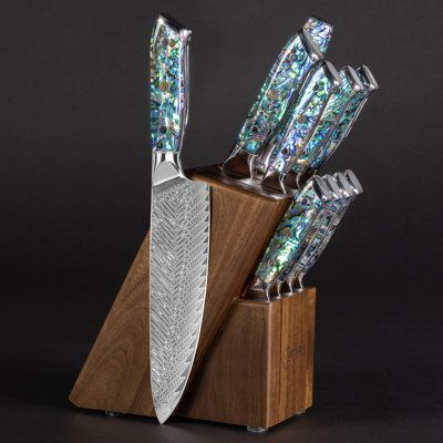 Complete 11-piece Damascus Steel Knife Block Set which includes our bestselling 5-piece Umi Damascus Chef Knife Collection, 4 matching Umi Damascus Steak Knives, Acacia Hardwood Knife Block, and a matching Umi Sharpening Steel. The knife block is smoothly finished Natural Acacia Hardwood with 10 total slots. Built to last a lifetime you will never need another knife block set again. All knives are forged from 67-layer Japanese Damascus Steel with an HRC Rating of 62 for unparalleled hardiness an Damascus Chef Knives, Boning Knife, Kitchen Cutlery, Damascus Steel Knife, Knife Block Set, Knife Collection, Cutlery Sets, Damascus Knife, Santoku Knife