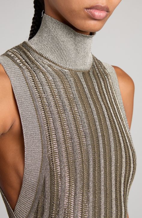 Metallic fibers bring eye-catching shimmer to this slinky sweater-dress fashioned with a high mock neck and deeply carved armholes. 35" length (size Medium) Slips on over head Mock neck Sleeveless 60% virgin wool, 28% viscose, 12% metallic fibers Unlined Dry clean Made in Italy Designer Clothing Metalic Outfits Ideas, Modern Knitwear, Creative Jewelry Photography, Metallic Knit, Buy List, Metallic Sweater, Knitwear Fashion, Chapter 3, Glitz And Glam