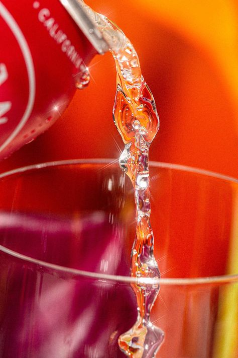 Art Direction, Photography, and Retouching by Weekend Creative. Styling by Jenna Baucke. Backdrops by Studio Cosita. // Beverage photoshoot featuring Ashland Hard Seltzer Tropical Cherry with bright red yellow purple colors. Styled with fruits and florals on a reflective mirror. High contrast and texture. Macro shot of liquid pouring. #foodphotography #beveragephotography #alcoholphotography #canphotoshoot #foodstyling #creativedirection #productphotography #productshoot #advertisingphotography Beverage Photoshoot, Weekend Creative, Commercial Photography Studio, Art Direction Photography, Camera Angles, Photography Resources, Food Photography Inspiration, Cool Electronics, Hard Seltzer