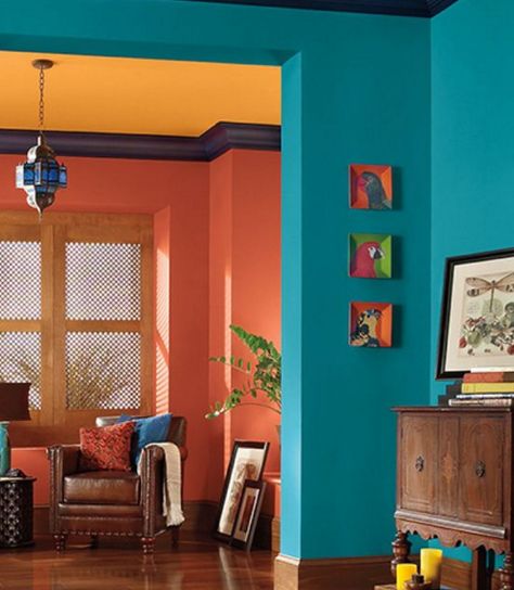 COLOR HARMONY: This is a split-complementary color scheme. The oranges on the back walls and ceiling are not true oranges; one is more red, and the other is more yellow. Diy Casa, Room Paint Colors, Room Color Schemes, Hus Inspiration, घर की सजावट, Blue Living Room, Design Del Prodotto, Love Style, Living Room Paint