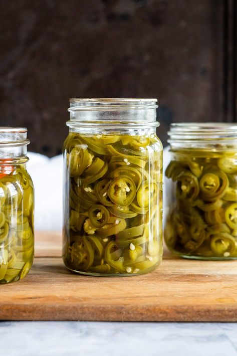 Do you love pickled jalapeños? If so, then you’re going to love this easy recipe for homemade Pickled Jalapeño Peppers. This simple recipe will have you preserving jalapeños in no time! You won't believe how easy it is to make your own delicious and spicy Pickled Jalapeno Peppers at home. They're perfect for topping burgers and hot dogs, adding a kick to sandwiches and tacos, or just snacking on right out of the jar! These tasty little guys are also great as an appetizer with cream cheese and cr Yellow Jalapeno Peppers, Preserving Jalapeños, Appetizer With Cream Cheese, Pickled Jalapeno Recipe, Canning Jalapeno Peppers, Pickled Things, Pickled Recipes, Burgers And Hot Dogs, Pickled Hot Peppers