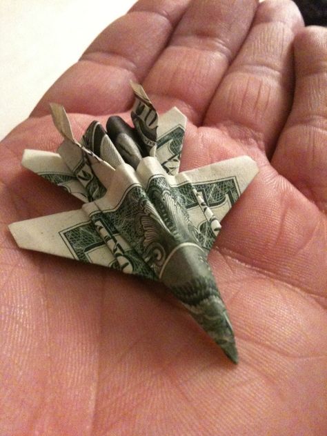 Paper Airplane - also perfect for presents  http://origami.wonderhowto.com/how-to/fold-origami-f-18-fighter-jet-out-dollar-bill-313882/ Jet Origami, Money Origami Tutorial, Origami Dollar, Origami Plane, Folding Money, Jet Airplane, Dollar Origami, Dollar Bill Origami, Creative Money Gifts