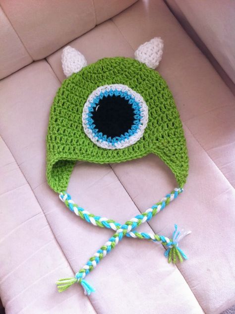 The past few months my days have consisted of having Monsters Inc. and Monsters University playing back to back on the TV. For some reason K... Crochet Mike Wazowski, Disney Crochet Hats, Monsters Inc Crochet, Earflap Hat Pattern, Crochet Monster Hat, Boys Hats, Crochet Character Hats, Monster Hat, Crochet Monsters