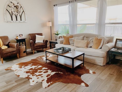 mustard living room accents & decor with cowhide rug Nguni Hide Living Rooms, Nguni Decor Living Rooms, Small Cowhide Rug, Cow Hide Living Room Decor, Texas Inspired Decor, Cowhide Living Room Ideas, Cow Hide Rug Living Room, Living Room Cowhide Rug, Cow Rug Living Room